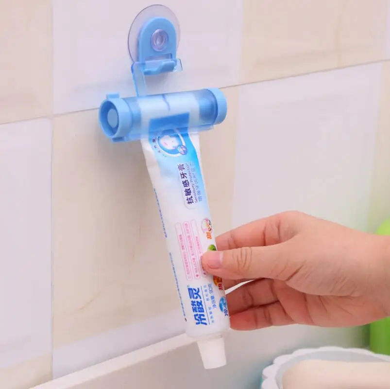 

1PCS Rolling Squeezer Toothpaste Dispenser Tube Partner Sucker Hanging Holder Color Random Bathroom Supplies