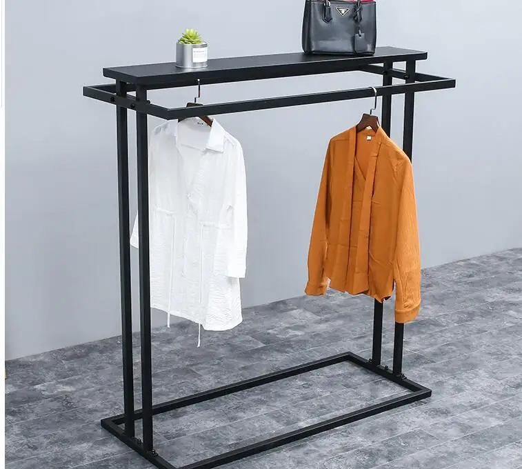 A display rack in the middle island shelf. Double row middle shelf. Parallel bars side hangers iron clothes hanger..062