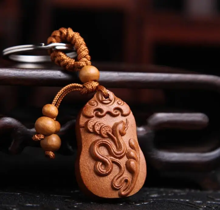 

Chinese Peach Wood Carved Word Safe And Auspicious Word Twelve Zodiac Animals Snake Exquisite Car Key Chain Pendant