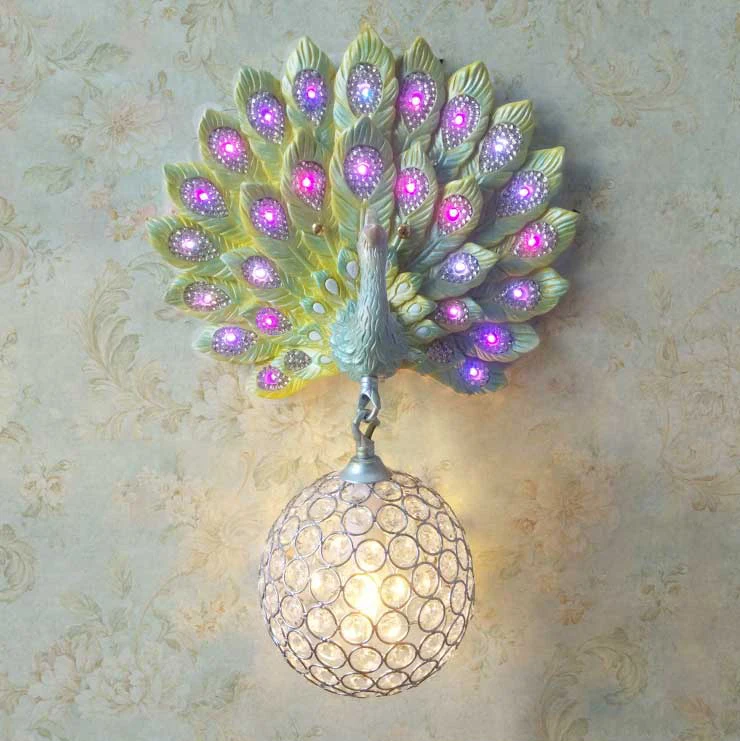 

Modern Luxury Southeast Asia Colorful K9 Crystal Metal Bird Nest Lampshade Resin Peacock Wall Lamp for Background Aisle