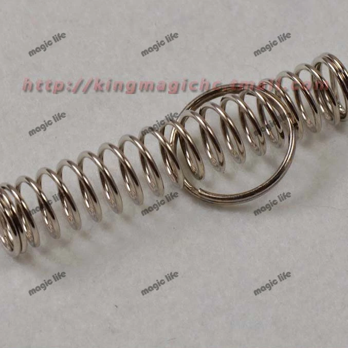 

Spring and Ring Spring magic locked in the spring of the steel ring to free shuttle close up magic magic props 20pcs each lot