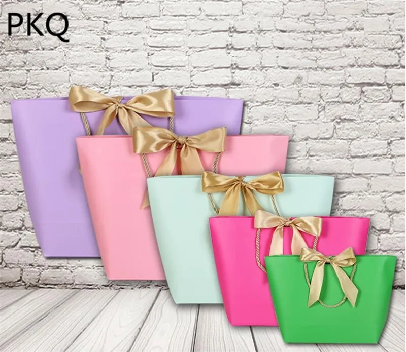 

10pcs/lot Large Bowknot Gift Bag small Wedding Christmas Packaging bag with Handle jewelry Paper Bag Kraft Paper ribbon Gift Bag