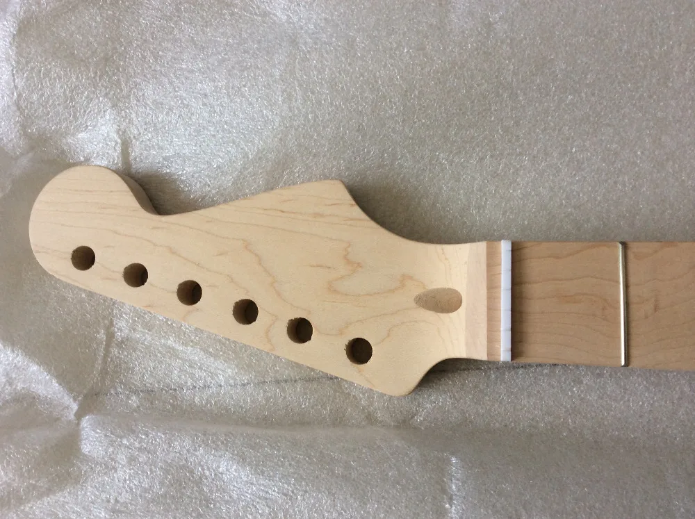 

one piece of electric guitar neck , maple fretborad