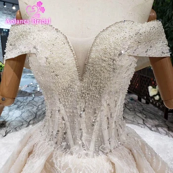 

Arabic Lace Crystals Pearls Wedding Dresses Ball Gown 2019 Elegant Boat Neck Off Shoulder Tulle Princess Bridal Gowns With Train