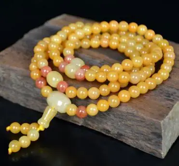 

Xinjiang natural gold silk jade bracelet new fashion gobi jade.