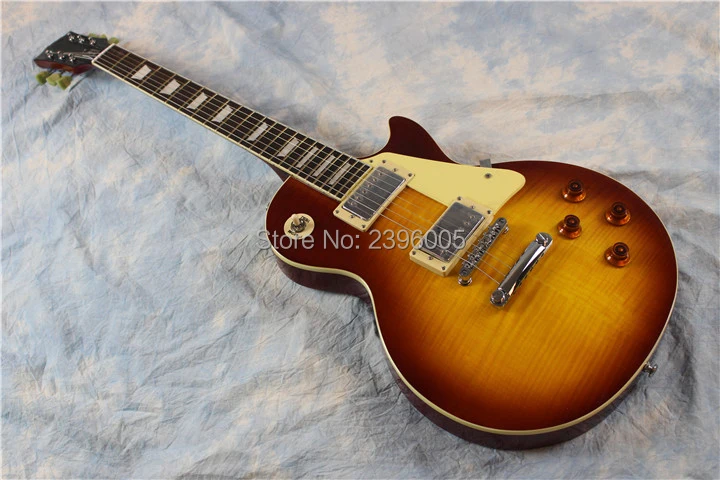 

mahogany electric guitar ,tiger striped flamed maple top.frets binding