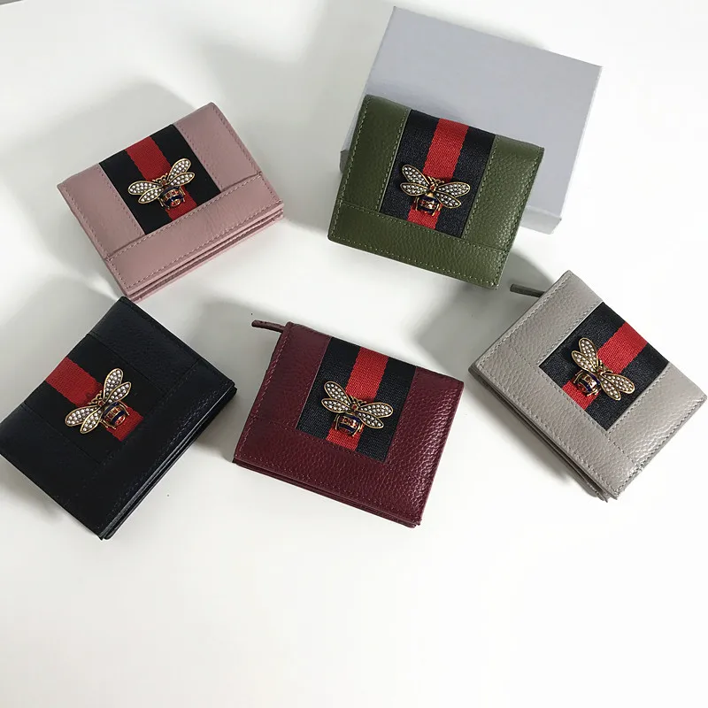 

Leather short paragraph bee pearl small wallet female Europe and the United States new leather color thin multi-card bit wallet
