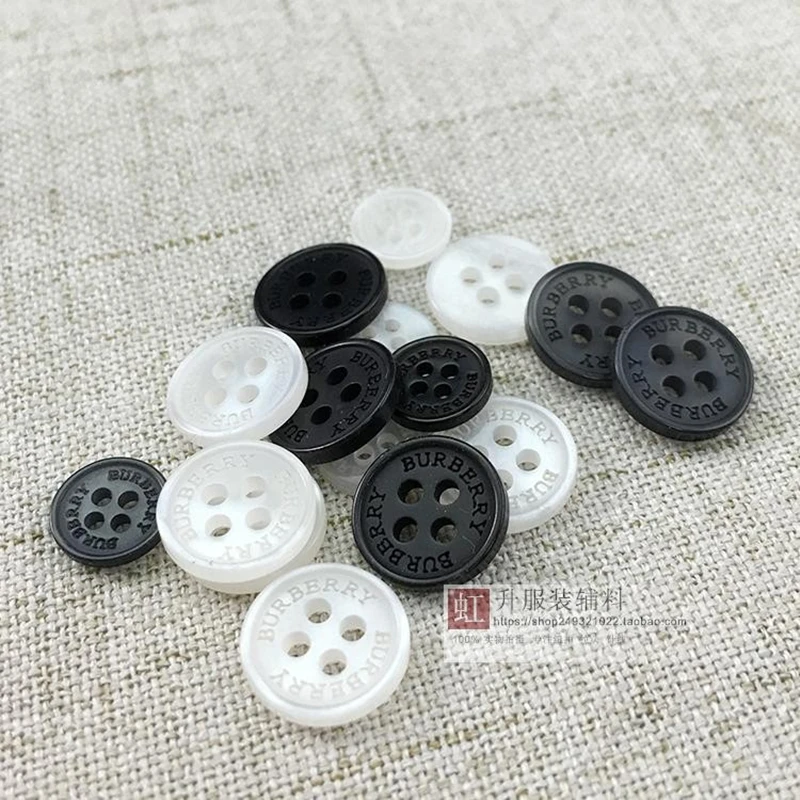 

1LOT=10pcs Four-holes high-grade resin buttons DIY sewing accessories black suit formal wear coat windbreaker fashion buckle