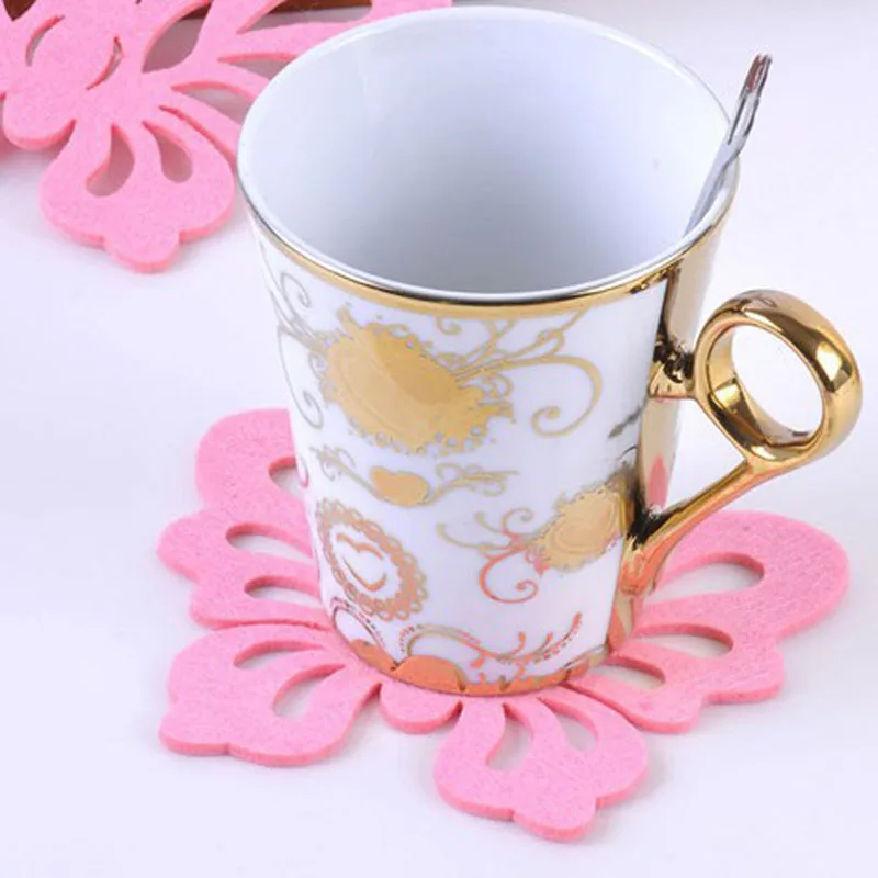 تحديد الموقع القرص فراشة على شكل وسادة حرارية العزل المنزلية الوقايات طبق فنجان القهوة مقاوم الحرارة حصيرة منصات لجدول عشوائي اللون