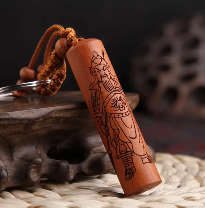 

Chinese Peach Wood Carved Cylinder Pendant Guan Gong Guan Yu Loyal And Righteous Word Exquisite Car Key Chain Pendant