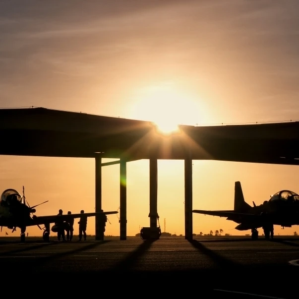 Two Embraer A-29 Super Tucano aircraft parked in the hangar at Natal Air Force Base  Brazil Poster Print (36 x 22)