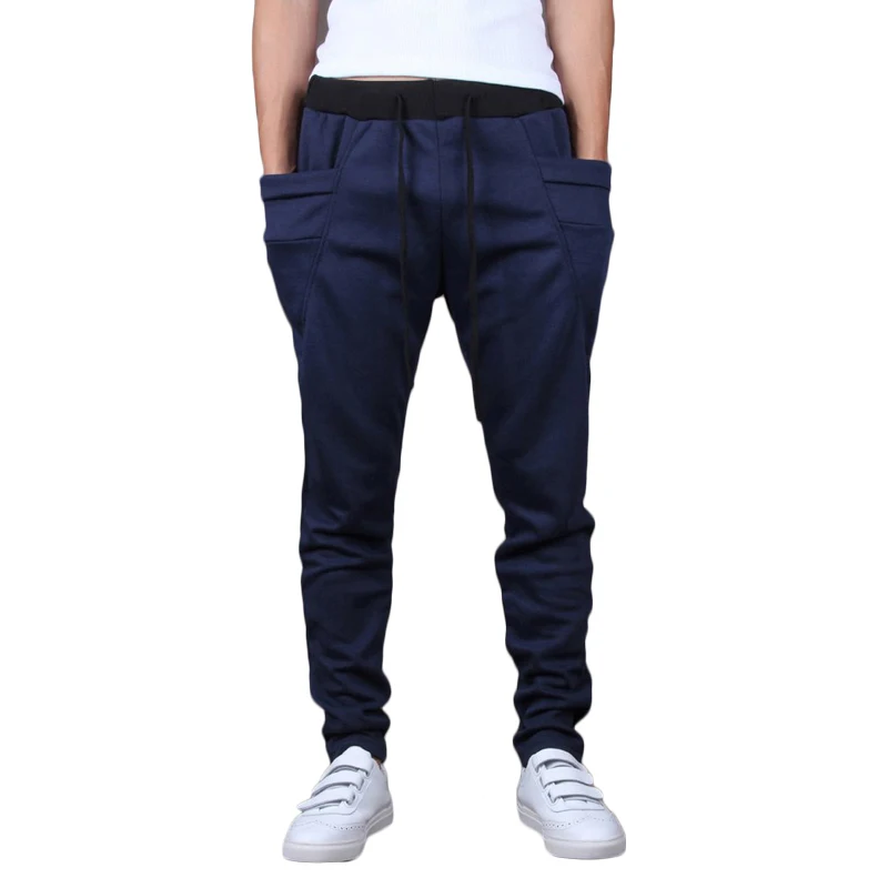 Harem joggers mens Baggy pants up the coolness factor and comfort level while channeling both street-style and sporty luxe. Drawcord and elasticized waists complement the relaxed fit or these harem pants or genie pants from hip to hem while variegated lengths at the hips and length show off your signature style.