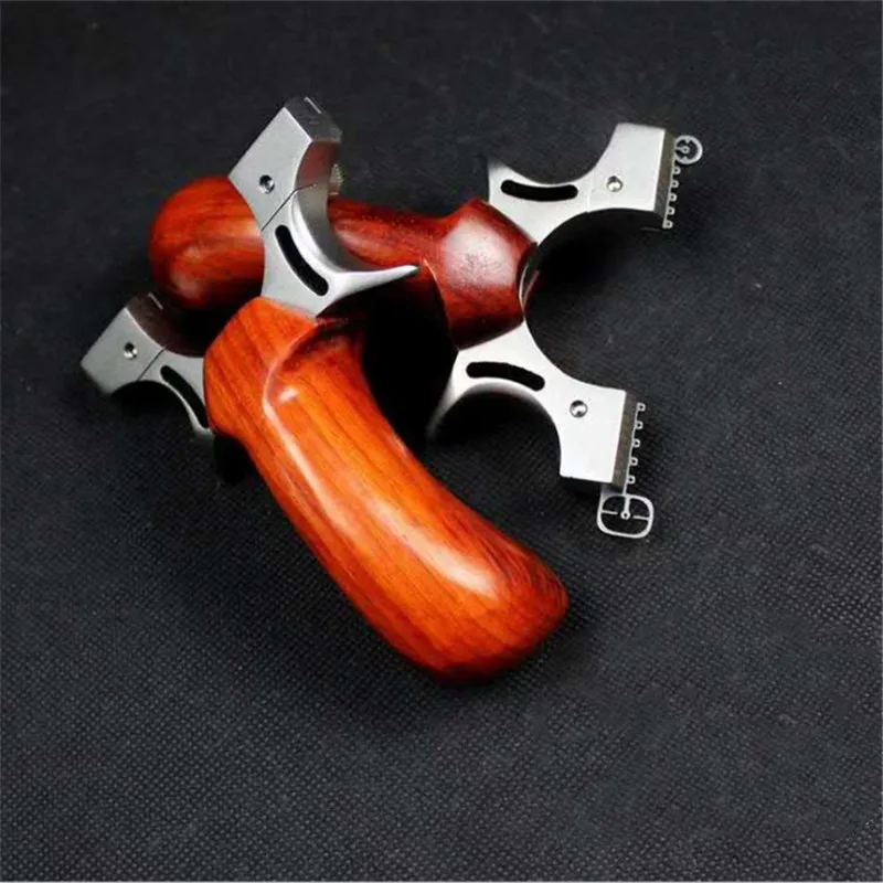 

Hunting Slingshot Stainless Steel Catapult + Wood Handle Outdoor Precise Shooting with 1pc Flat Rubber Band 2019 New