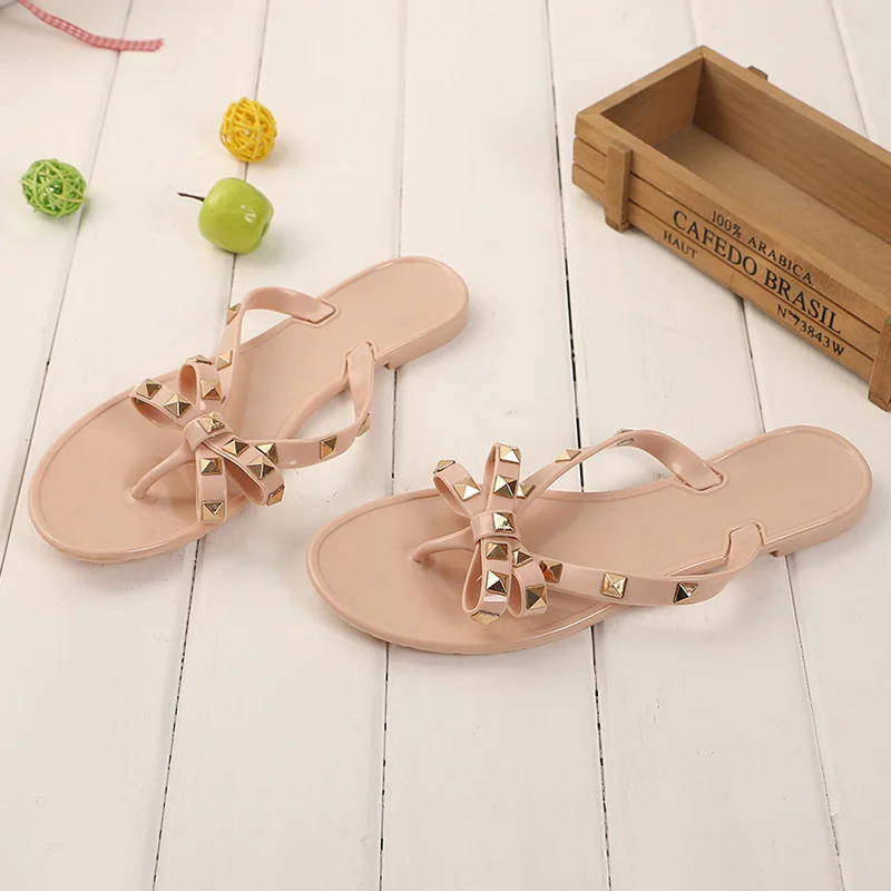 

Women's shoes 2018 Summer new sandals and slippers Flat with bow rivets slippers Flip-flops Garden jelly beach sandals