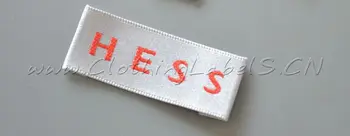 

custom woven label for clothing, stain material, washable and recycled, as customized design. selvage labels.