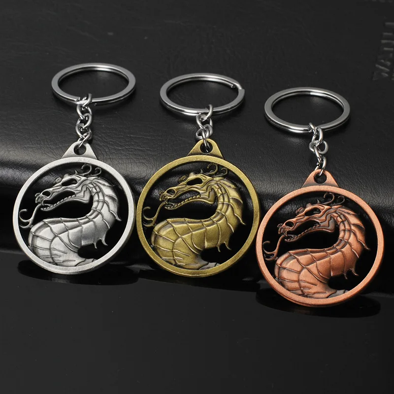 

The game of rights Kombat Mortal Kombat Empire The legendary magic dragon pattern keychain The hollowed out keychain