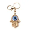 Fashion Gold Color Hollow Out Hamsa Hand Key Chain Turkish Evil Eye Crystal Fatima Palm Key Ring ► Photo 1/6