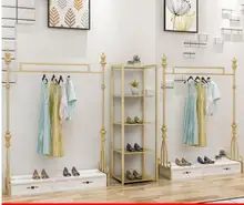 Cheap Clothing store display rack floor type women's clothing store European shelf hanging rack display clothes rack gold. Cheap Clothing store display rack floor type women's clothing store European shelf hanging rack display clothes rack gold.