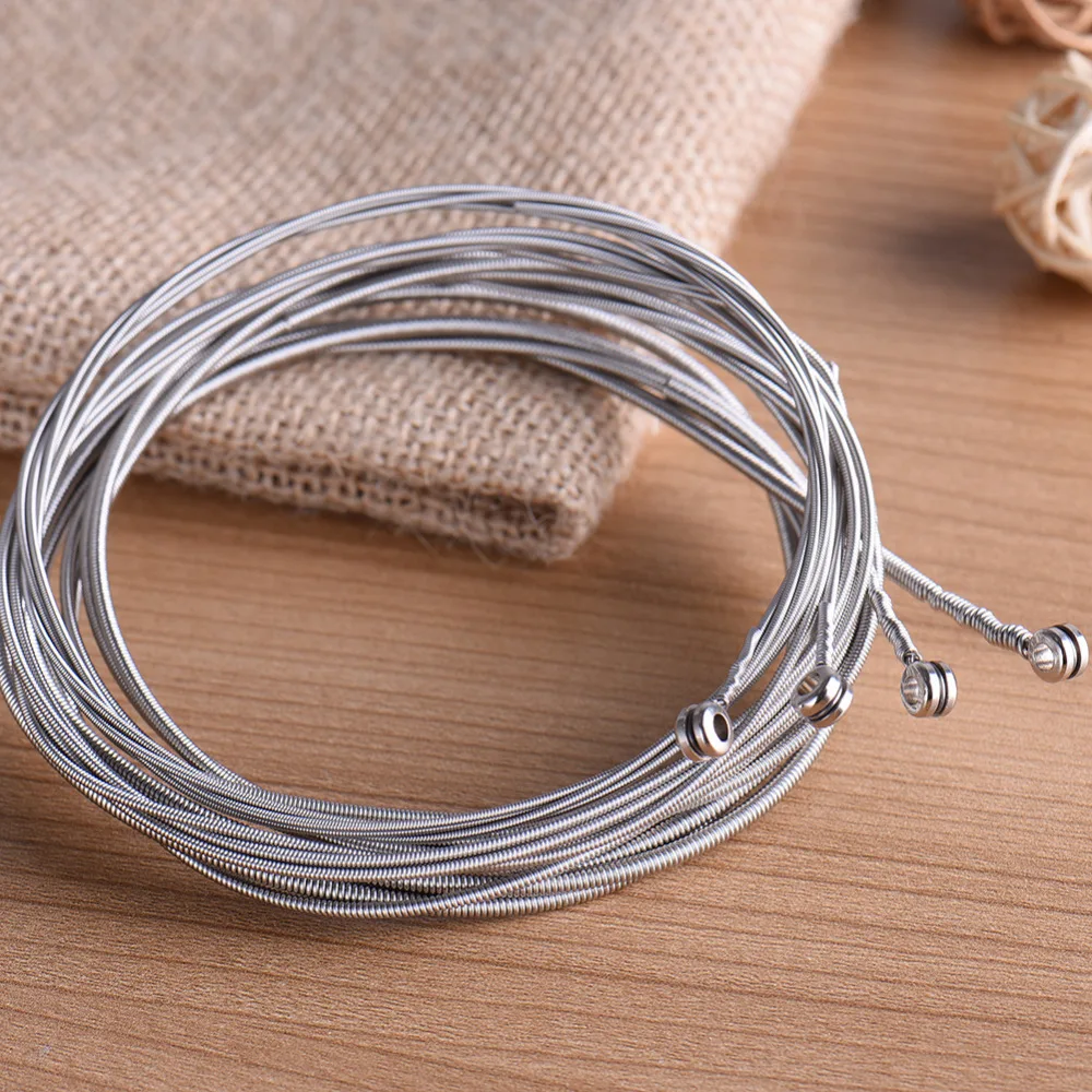 нержавейка струны. струны из стали. металлические струны для гитары. на струне. струны из стали.