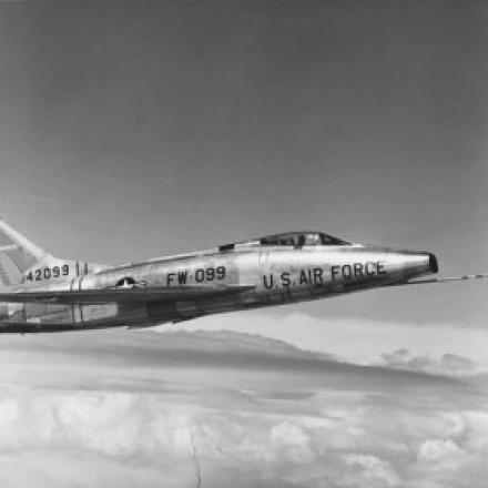 Side profile of a fighter plane in flight  F-100C Super Sabre Poster Print (18 x 24)