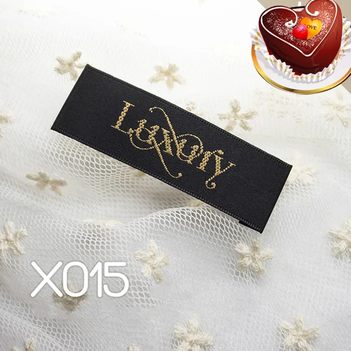 

100pcs/lot Spot supplies High quality Wood shuttle material Black woven label logo Luxury Queen End Folder Garment accessories