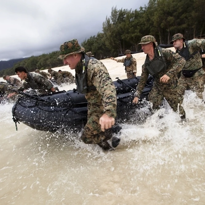 Force reconnaissance Marines sprint into the water with their F470 Combat Rubber Raiding Crafts Poster Print (17 x 11)