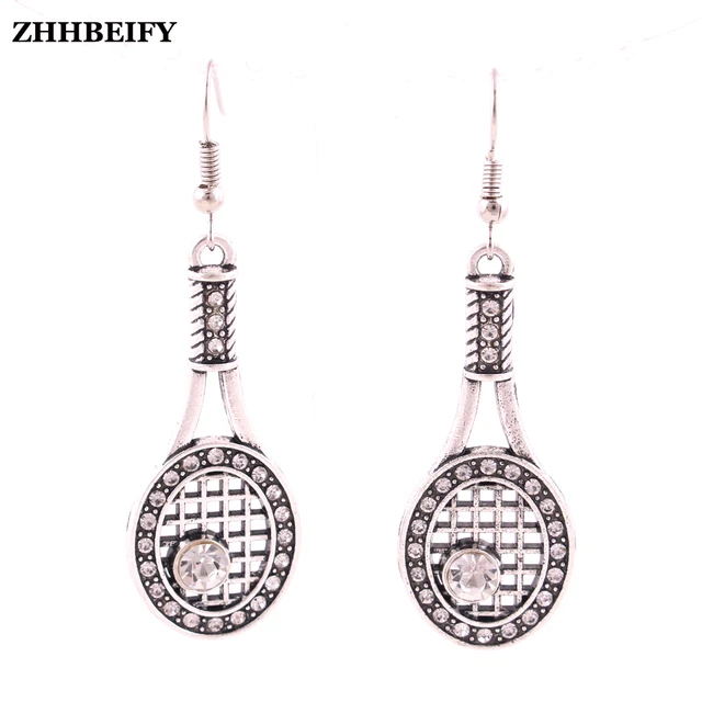 Silver Tone Earrings With Crystal Covered Tennis Racquet Charm In Silver Tone Earrings With Crystal Covered Tennis Racquet Charm In Surgical Steel Post Or