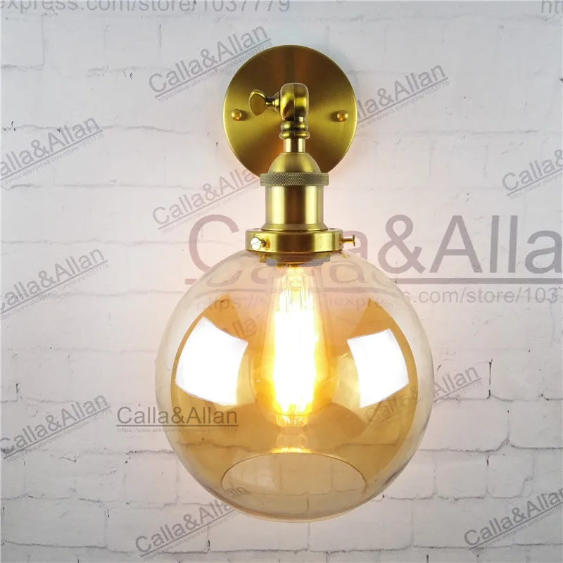 ANTIQUE BRASS AND AMBER GLASS WALL SCONCE