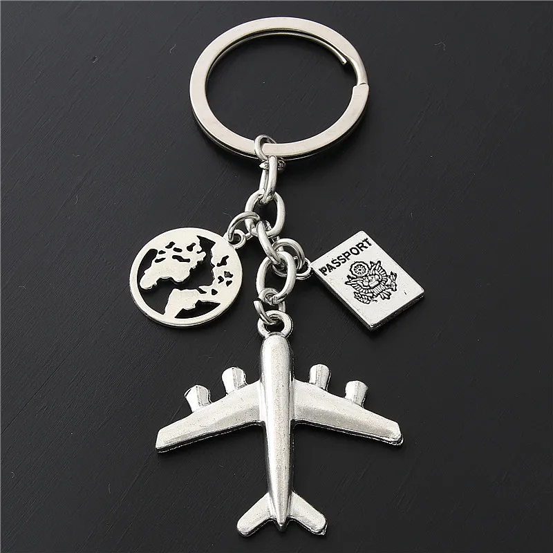 Porte-clés Souvenir Avion Et Appareil Photo En Métal Argenté - Neuf Avec étiquettes, Fabrication Chine