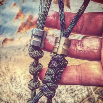 

1PC EDC Tools Titanium Alloy Knife Beads Rope Pendant Manual Umbrella Rope Pendant Beads Necklace Key Ring Personality Outdoor
