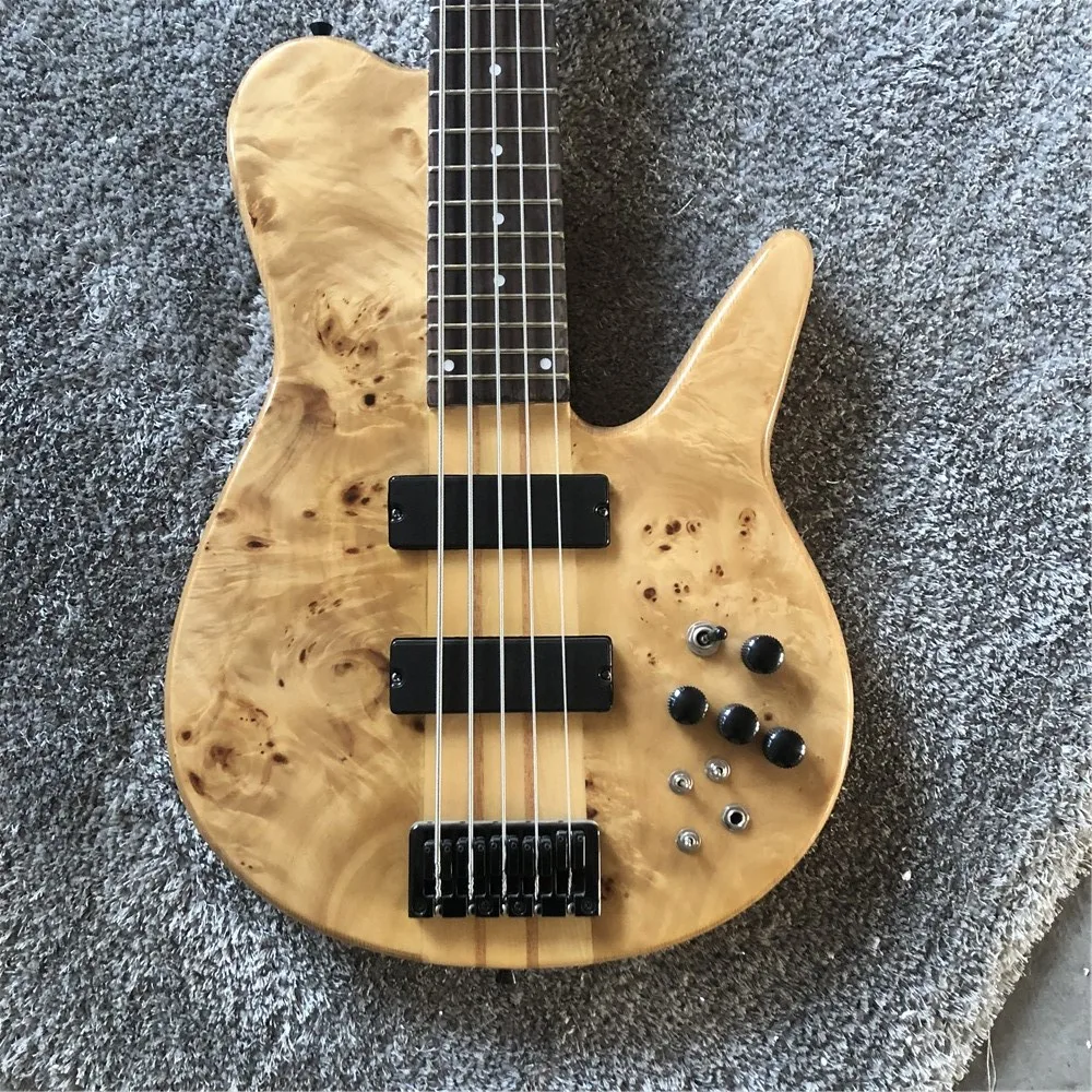 

Kaiyun Factory custom 5 strings. Wood color. Whole body. Butterfly electric bass. Black metal hardware.