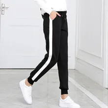 women's black track pants with white stripe