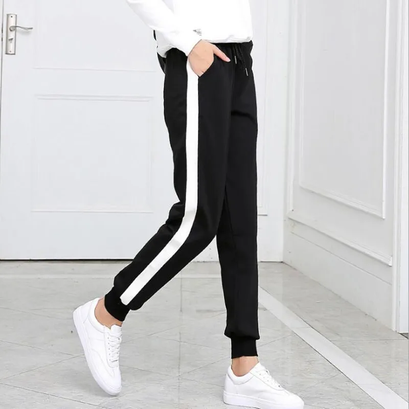 black track pants with white stripe