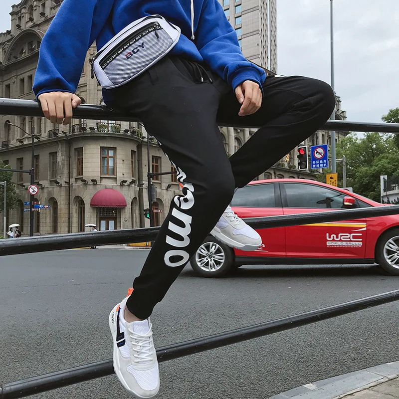 

Spring and autumn tide brand men's casual trousers pure color printing bouquet feet feet pants men's sports casual pants men