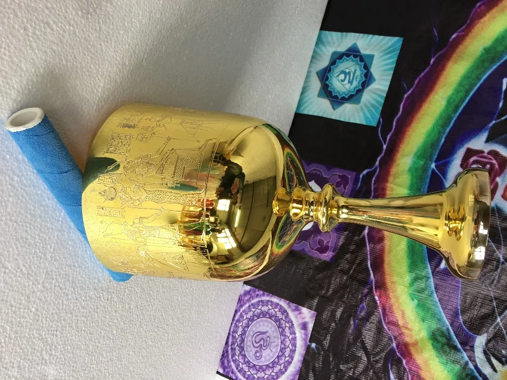 

alchemy golden crystal singing bowl with Egyptian carved with 4th octave perfect C or D or C# note about 6.5"