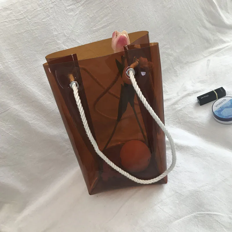 

Women's bag 2019 new Japanese transparent curry handbag INS take the commuter bag open single shoulder women's bag