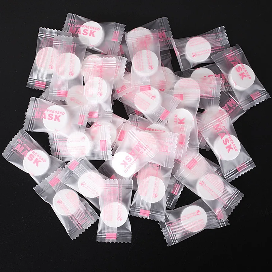 

by DHL 100bags 100pcs/bag Compressed Facial Face Mask Women Beauty DIY Disposable Mask Paper Natural Skin Care Wrapped