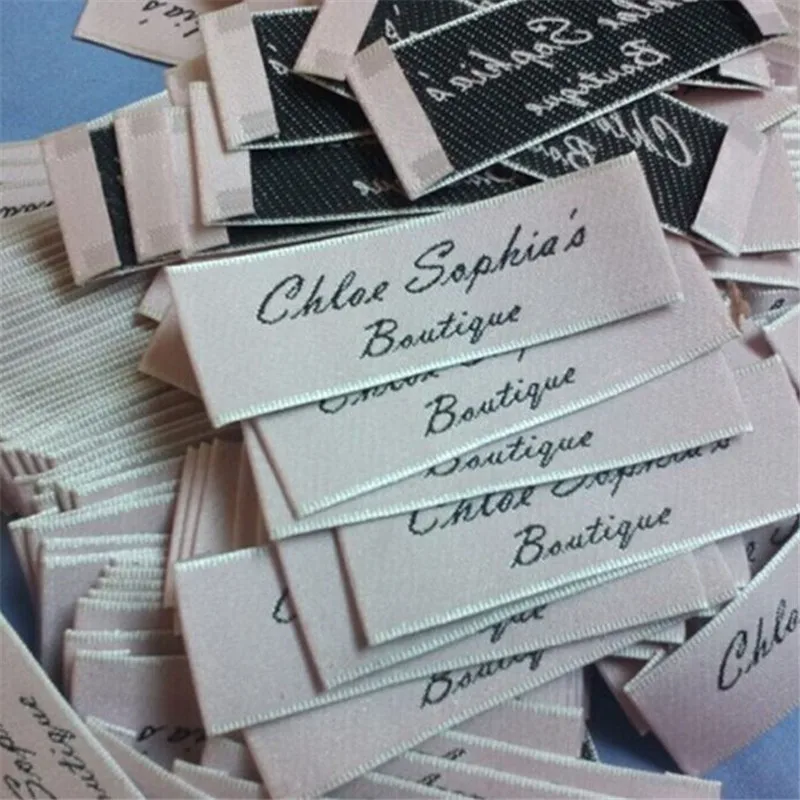 

1000PCS , 6 * 2 cm OEM Custom private name end fold Clothing woven label Light pink tags