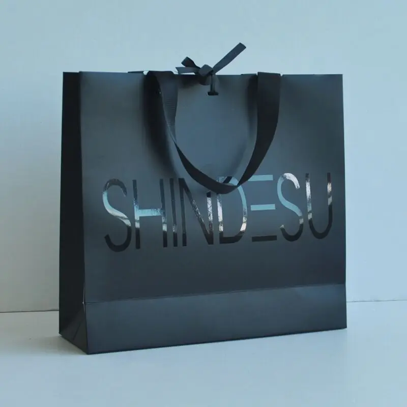 

wholesale 3000pcs/lot Customized shopping bag logo with wide ribbon handle paper gift bag with black foil logo for cloth jewelry