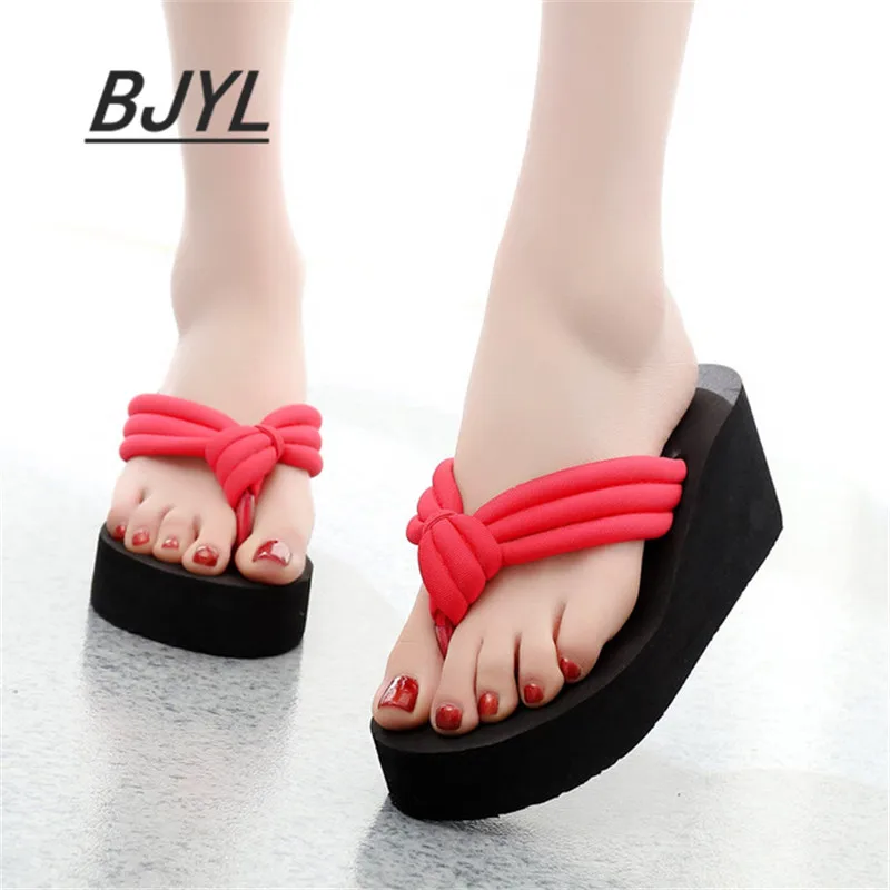 

High-heeled thick-bottom beach anti-skid flip-flops female summer fashion wear pinch student sandals and slippers