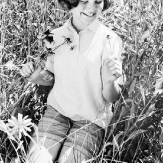 Girl with flowers on meadow Poster Print (18 x 24)