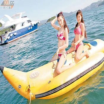 inflatable banana boat 2 people playing on the beach surf riding water game water toys sunstart on the beach book 2