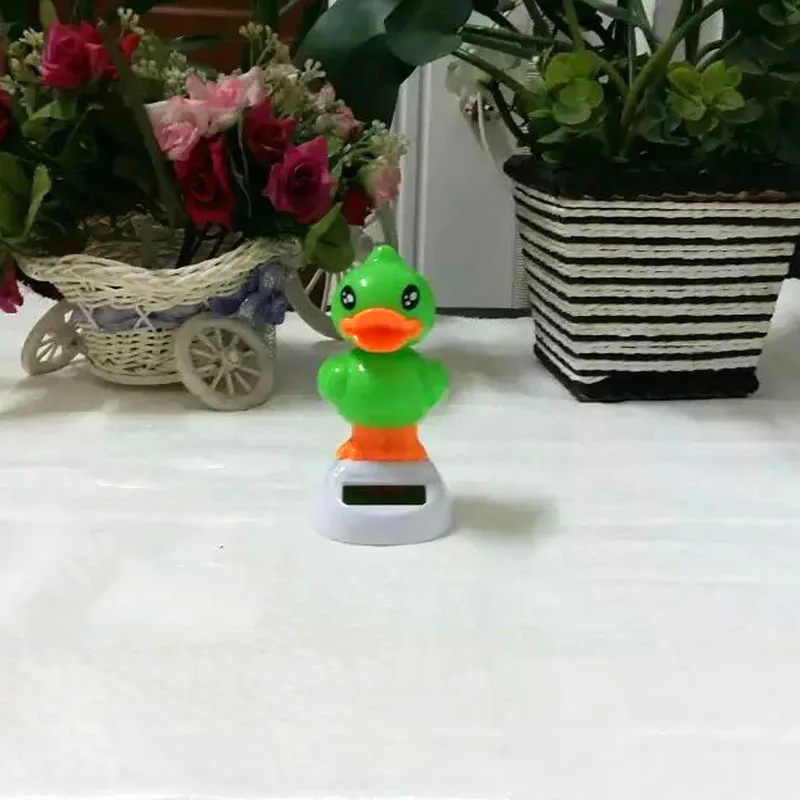 Wholesale 10 Pieces Per Lot Swing Under Sunshine No Battery Novelty Duck Toys Flip Flap Solar