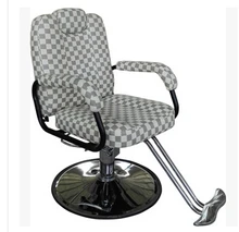 Hair salon barber chair. Hairdressing chair. Put down the barber chair.