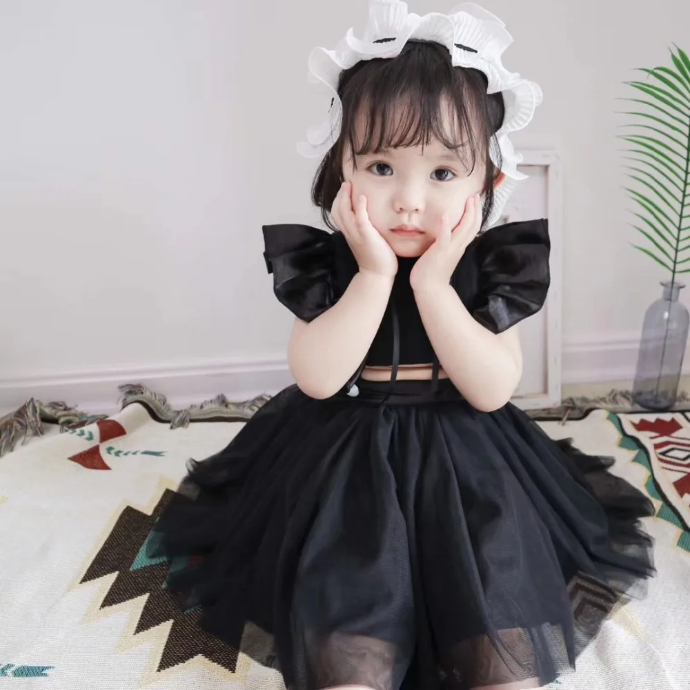 Black dress outfits with veiled babies out