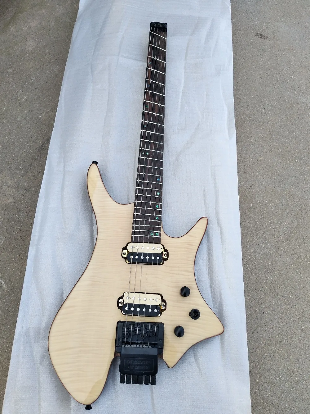 

fan shaped 24 frets headless electric guitar