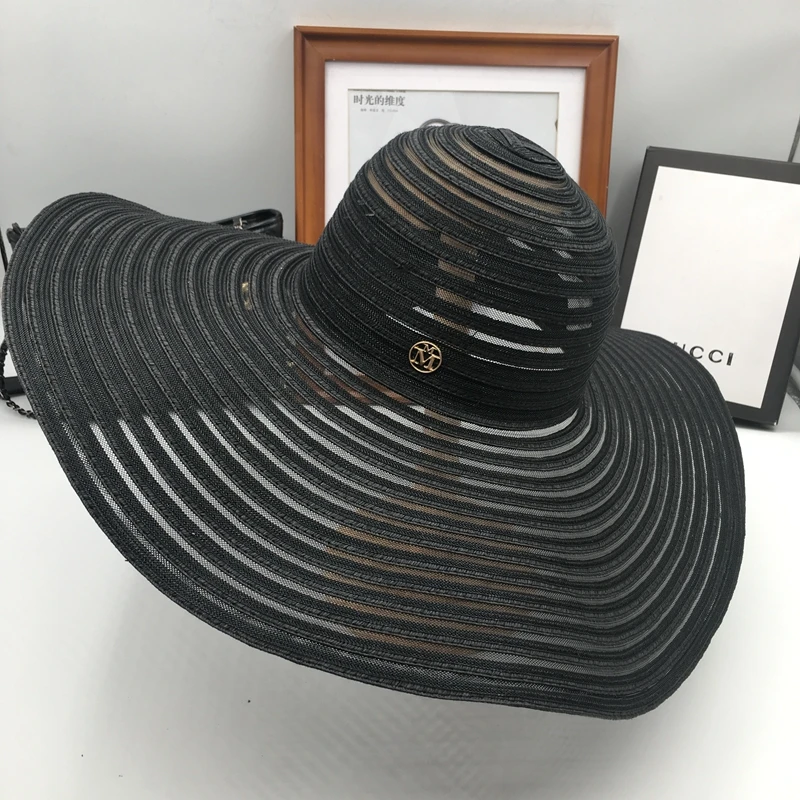 Folding large black summer sunshade is 