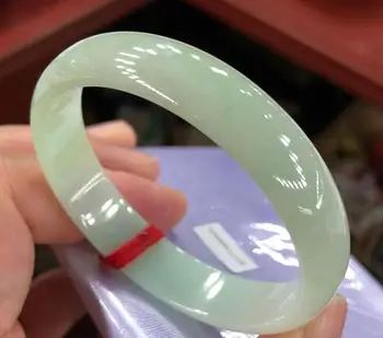 

Natural Burma yu fine waxy, floating green and flat bracelet. /