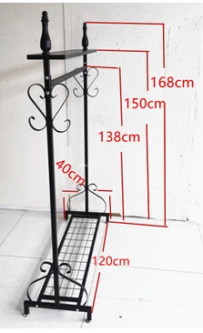 Wrought iron clothing store display shelf. Console clothes rack. Clothing racks display shelf.