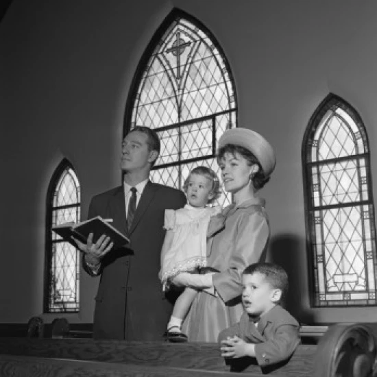 Family with daughter and son singing in church Poster Print (24 x 36)